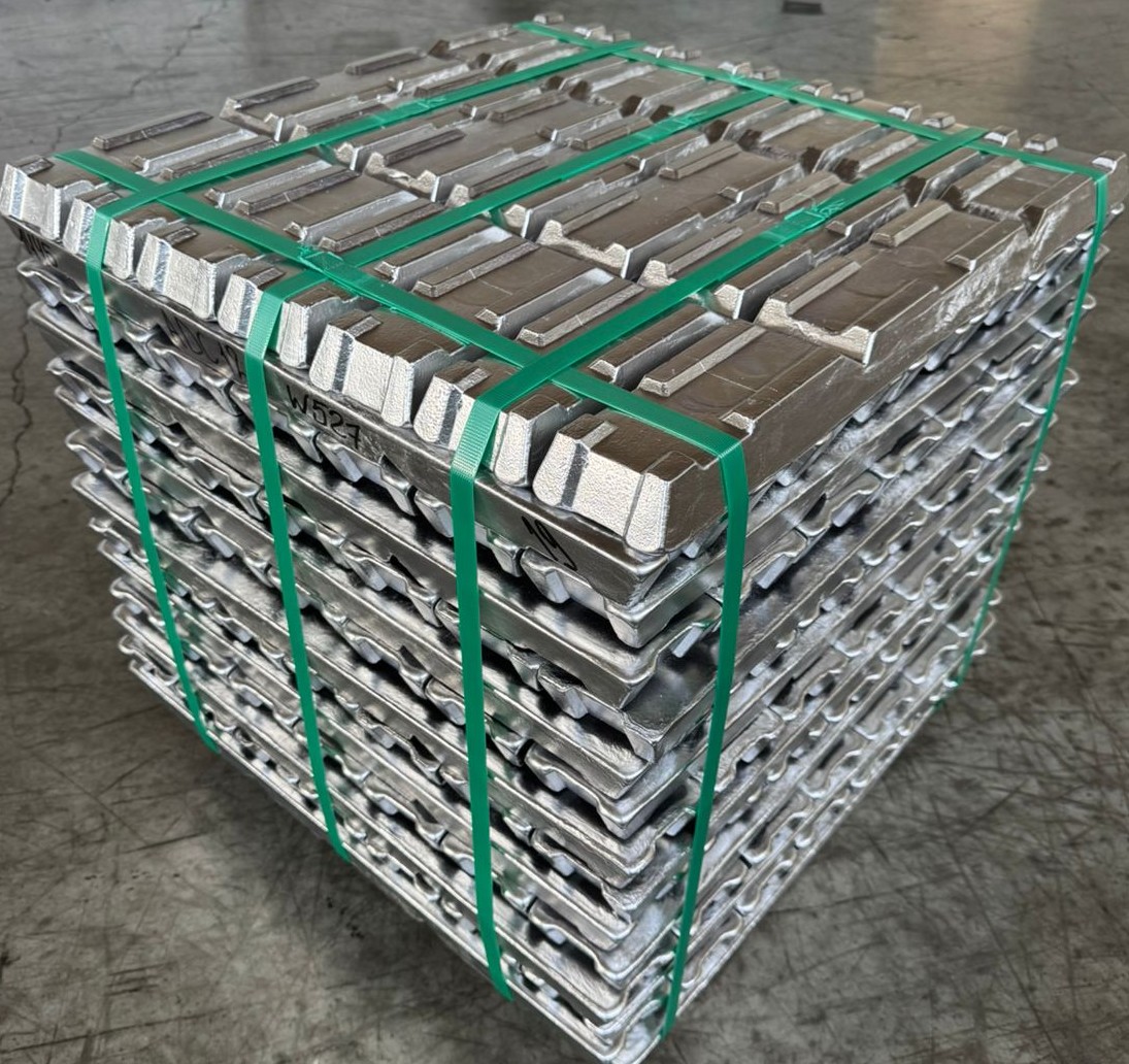 Stack of aluminum ingots strapped with green bands